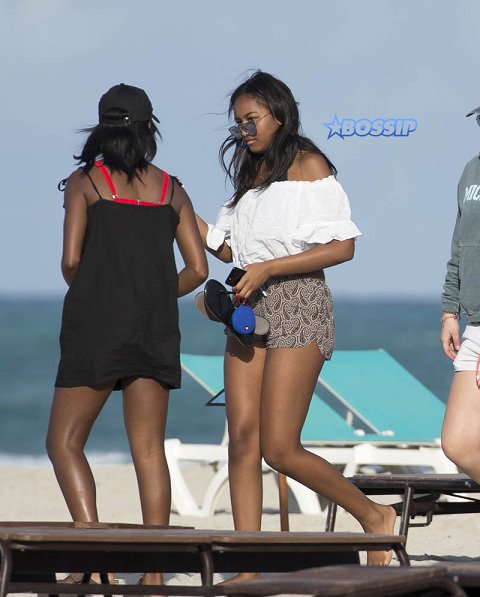 Sasha Obama spends time on the beach in Miami after missing her fathers farewell speech.